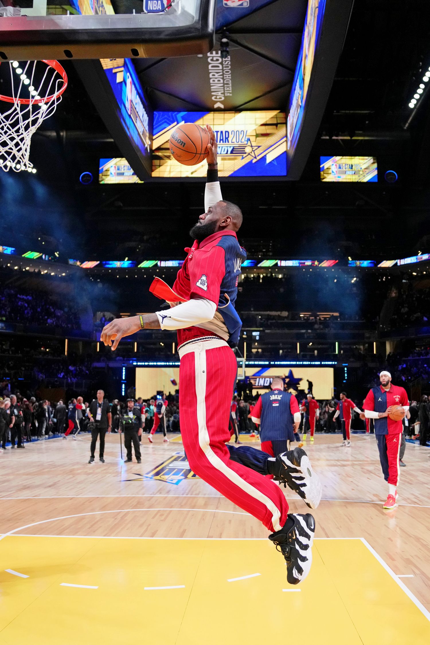 LeBron James dunks during warms up before the 2024 NBA All-Star game.
